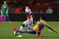 MONACO - AUGUST 25:  Thomas Lemar (L) of Monaco is tackled by Enzo Perez of Valencia during the UEFA Champions League qualifying round play off second leg match between Monaco and Valencia on August 25, 2015 in Monaco, Monaco.  (Photo by Valerio Pennicino/Getty Images)